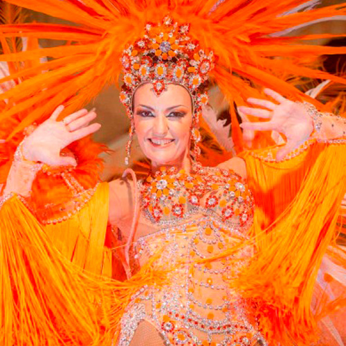 Aderezo artesanal para ballet de Carnaval en color naranja, diseñado y elaborado a mano por Juan Lillo Artesano, con detalles elegantes y llamativos.